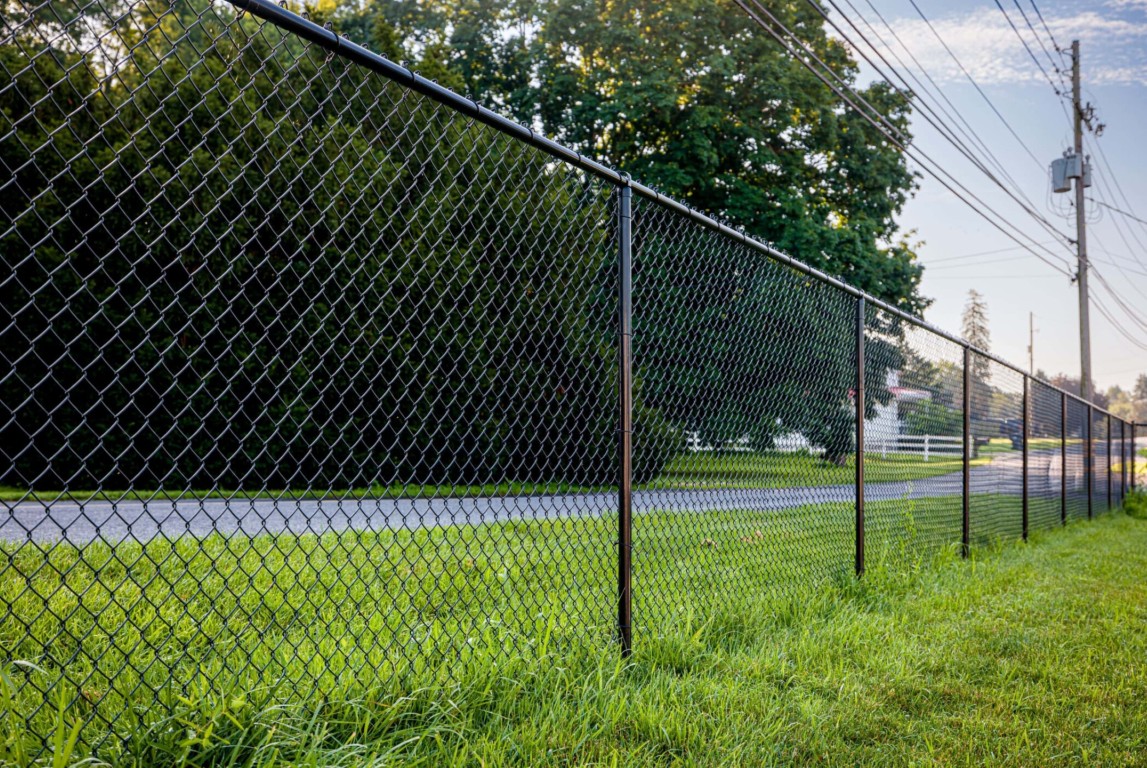 Commercial chain-link fence installation along street in Perth Amboy